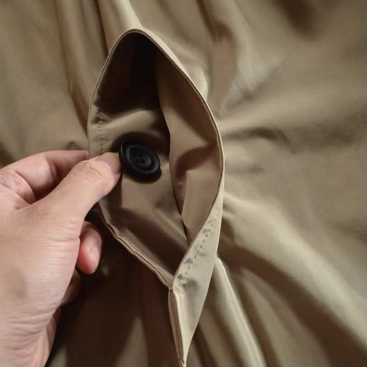 Mid-length men's coat with front button placket and classic turn-down collar