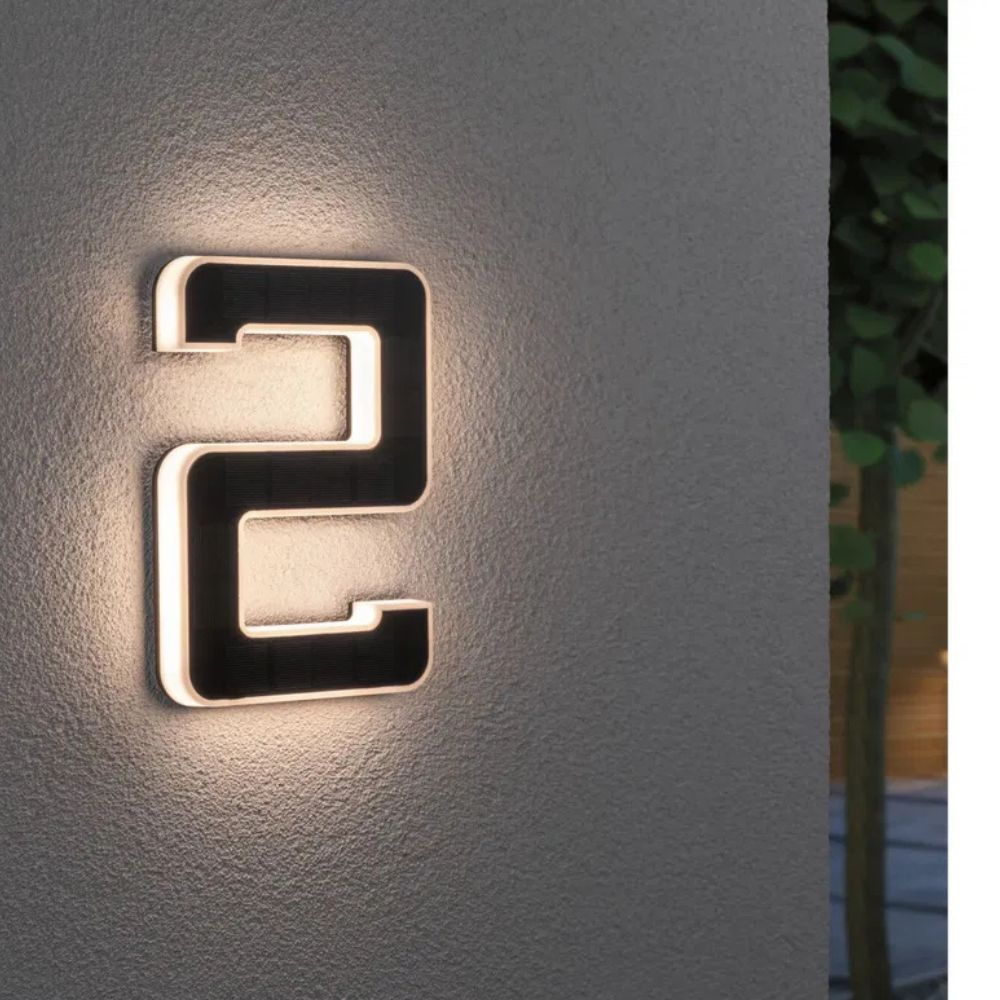 Solar-lit house number with LED and dusk sensor