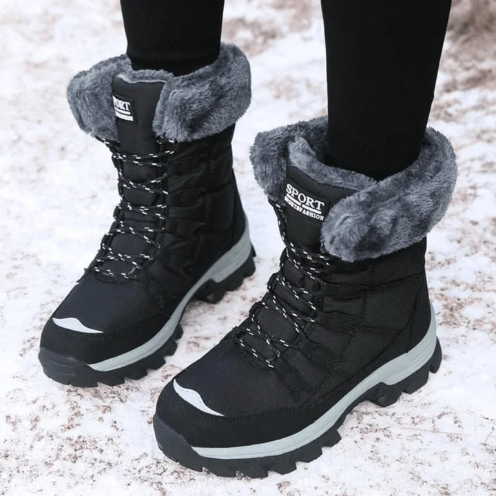 Women's warm waterproof fur-lined winter boots with lace-up quilted design